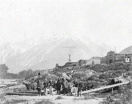 [ Bella Coola; Dr. Powell (centre) and Hamilton Moffatt (third from right), Unknown, BCA A-03980 ]